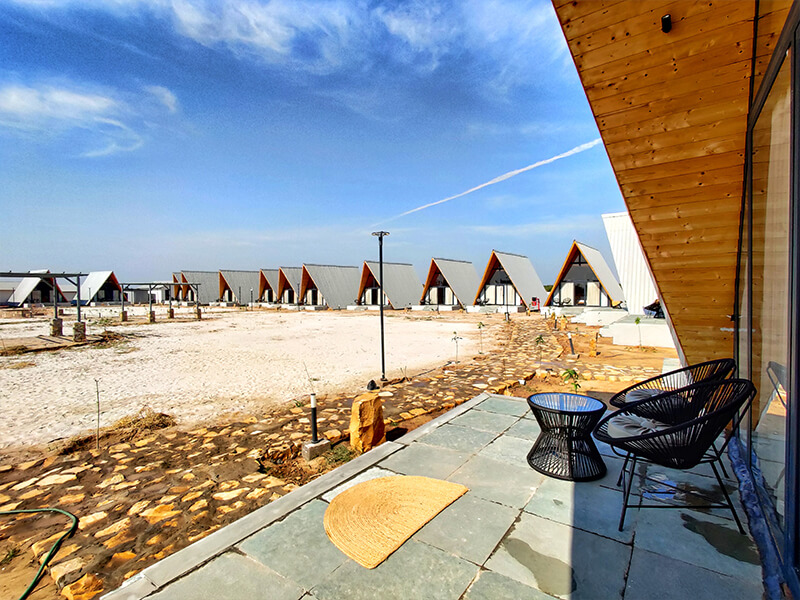 Praveg Resort Dholavira - row of A-frame cabins